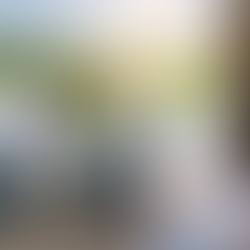 People inspecting car damage while another person fills out insurance form