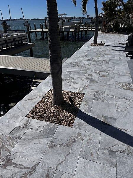 Veneer stone paver pool deck in Treasure Island, Florida