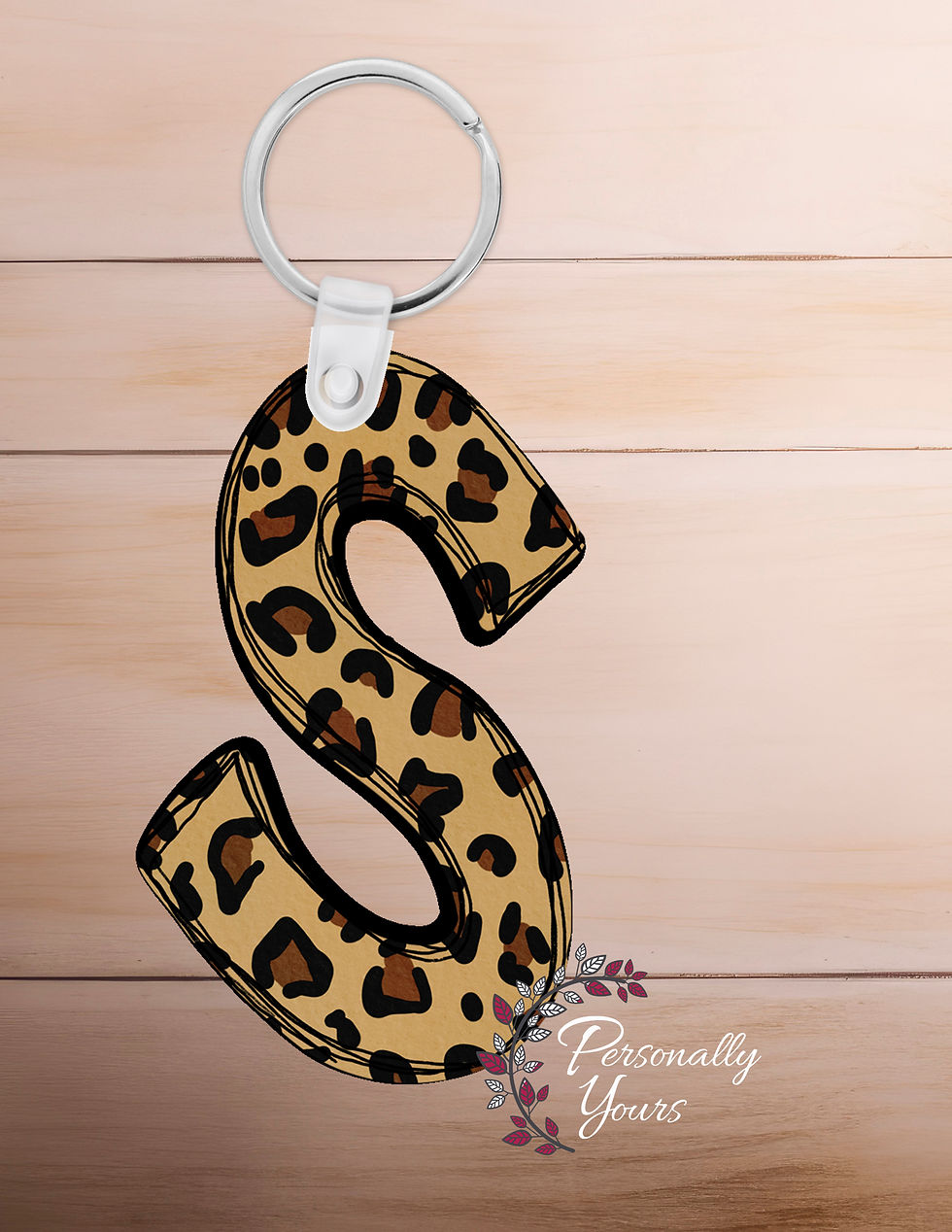 Leopard print letter S acrylic keychain with gold key ring and neutral animal print pattern