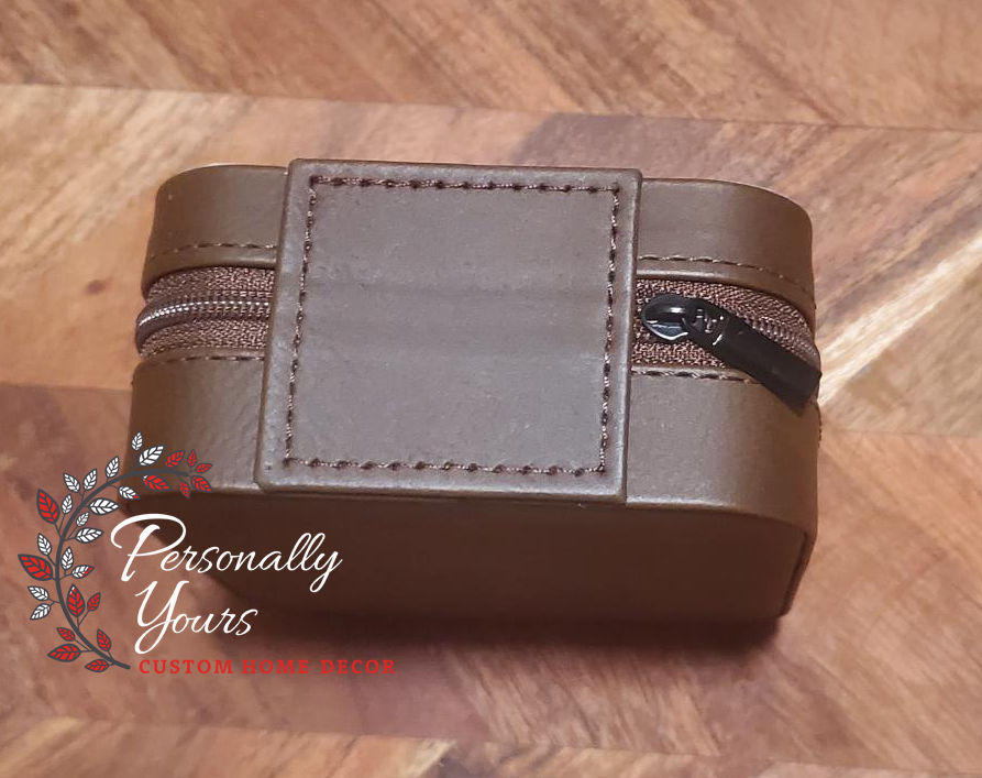 Thumbnail: Back view of brown faux leather travel jewelry box with stitched panel and zipper closure.