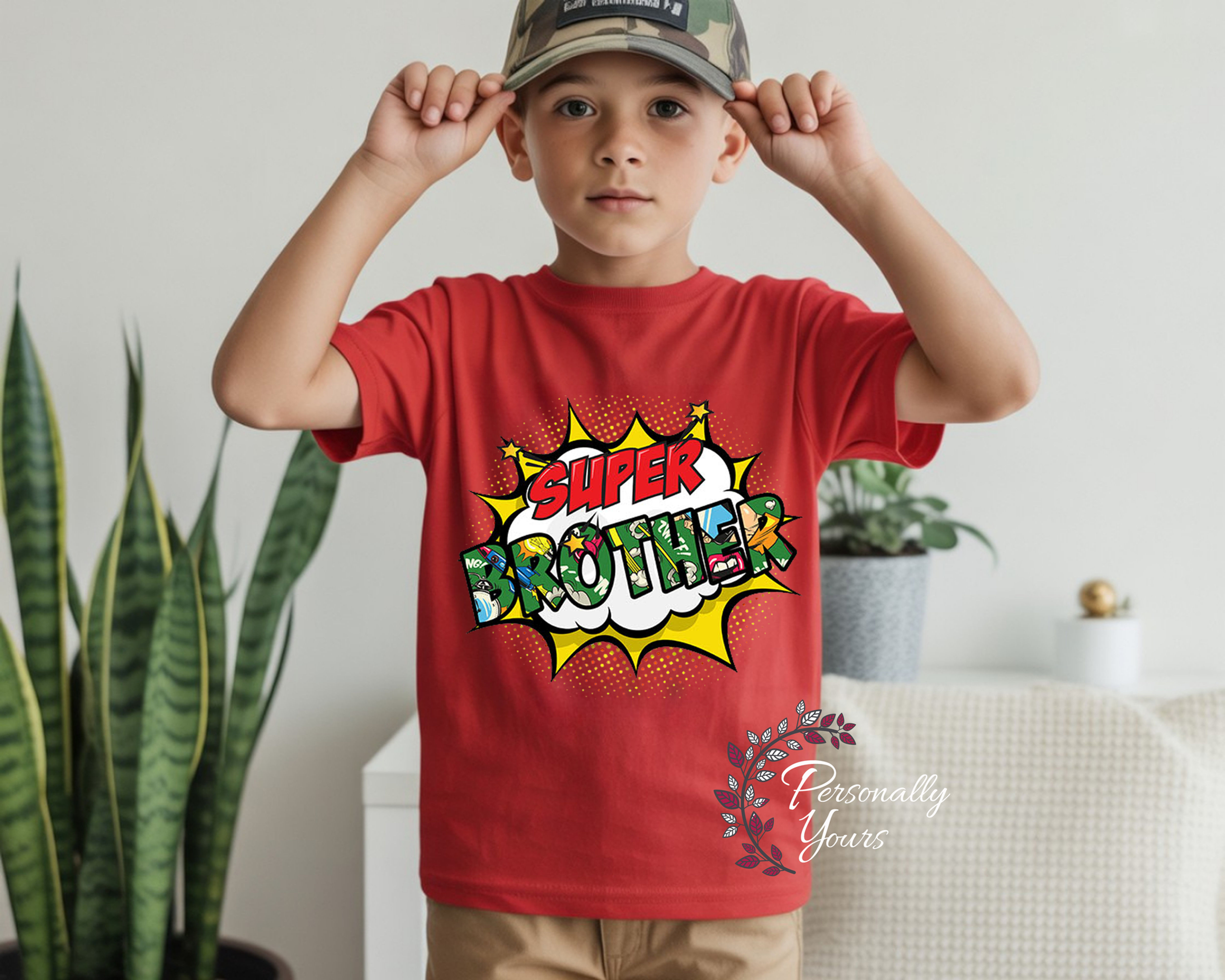 Super Brother youth graphic t-shirt featuring colorful comic book superhero design on red premium youth tee