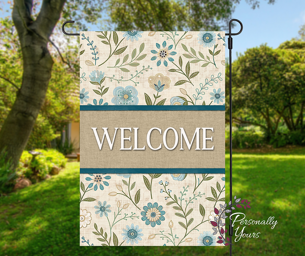 Blue wildflower welcome garden flag with custom family name displayed outdoors on black garden flag stand.
