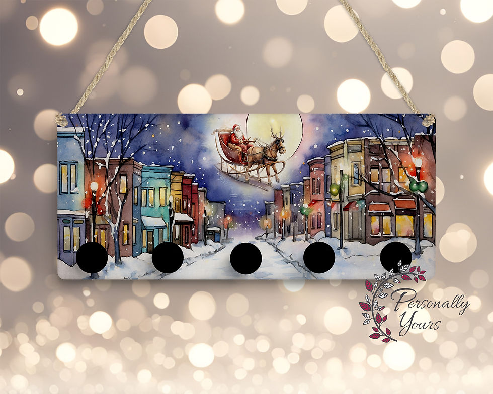 Christmas Eve stocking hanger with Santa's sleigh, snowy Main Street storefronts, and five black knobs.