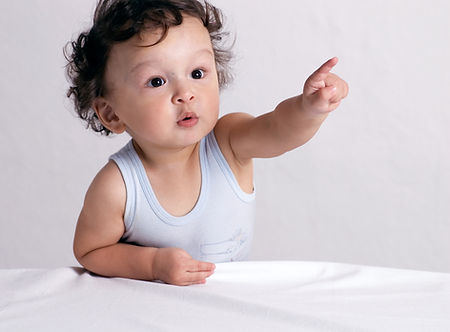 curious toddler pointing