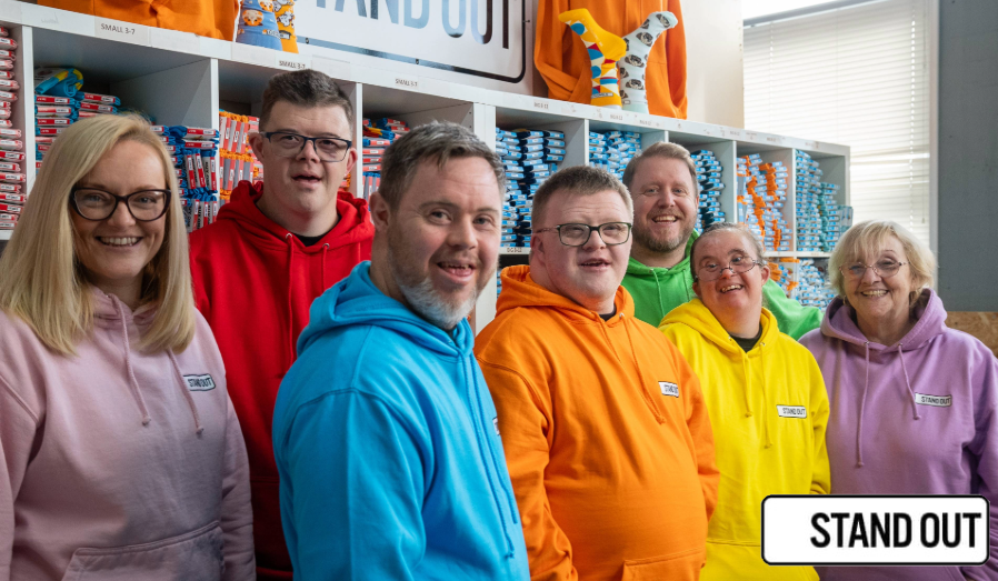 The stand Out Socks Teams dressed in bright hoodies
