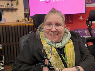 Sarah Morris holding her Latifa Sanneh Award