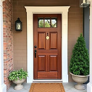 a freshly refinished wood front door.jpg