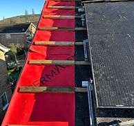 Roofing team working on a residential roof