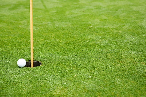 Golf ball and hole