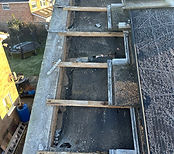 Construction crew performing roof maintenance