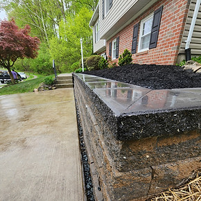 Retaining wall with garden to enhance your home's curb appeal.