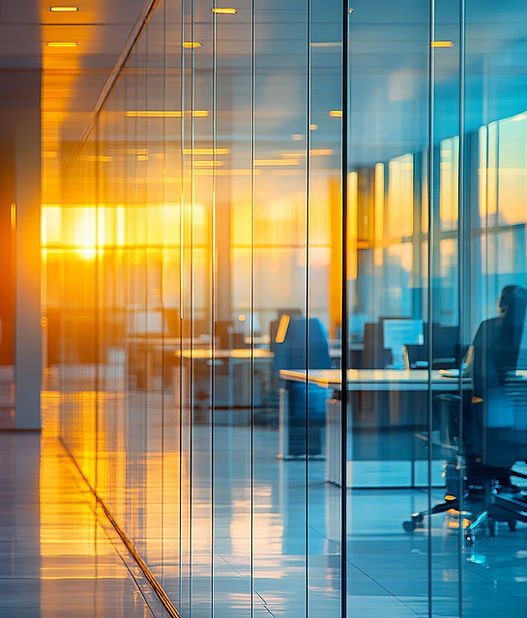modern-office-features-glass-walls-that-reflect-warm-glow-sunset-highlighting-vibrant.jpg