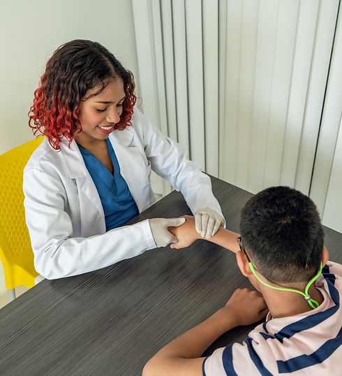 A nurse is examining a patient's arm.