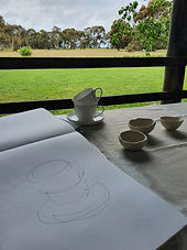Lynwood pottery view with contour drawing and porcelain pinchpots