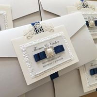 Thumbnail: handmade pocketfold wedding invitations