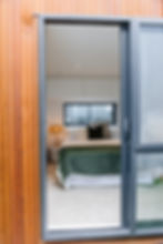 Downstairs bedroom with front entry