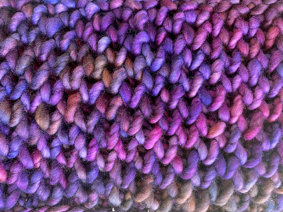 Thumbnail: close up of knit below stitches in purple