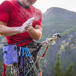 Rock Climber Powdering Hands