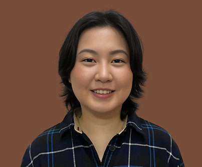 Portrait of Alyssha Teh, remedial massage therapist at SYNC Therapies, photographed against a warm brown backdrop.
