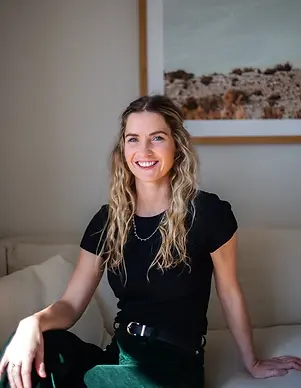 Sophie Hannan of Sophie Hannan Osteopathy, photographed in a calm indoor setting with soft natural light.