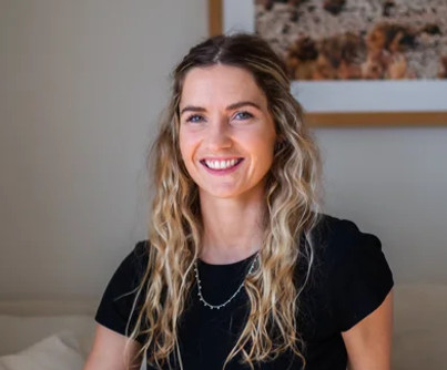 Portrait of Sophie Hannan, osteopath at SYNC Therapies, photographed in a calm indoor setting with soft natural light.