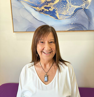 Alanna Silato of Restore and Rebalance at SYNC Therapies, photographed in a calm, softly lit setting with a closer crop.