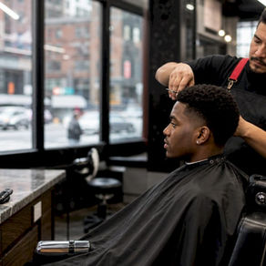 Client getting haircut from familiar barber in shop
