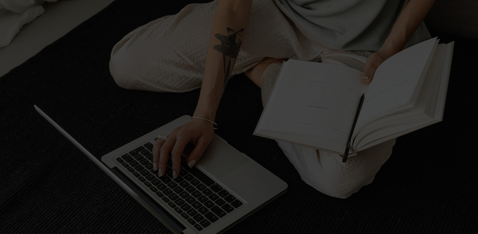 Notebook working on laptop creating marketing strategy