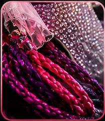 Close-up of rhinestone jeweled motorcycle helmets with braids