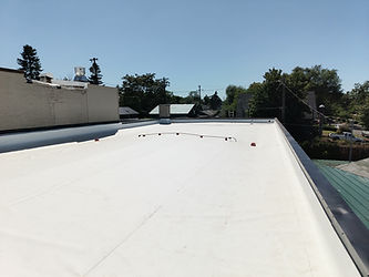 Brand-new white single-ply commercial roof