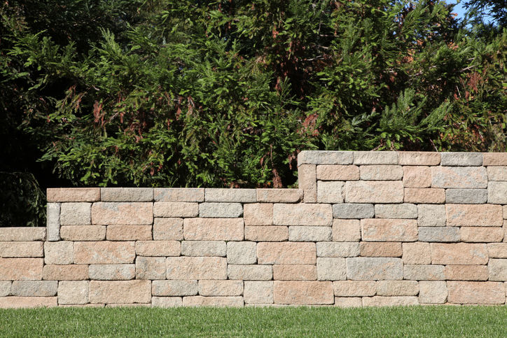 Discover how Ground Control of Carolinas, Inc. in Charlotte, NC designs effective retaining walls and drainage solutions for sloped yards. Contact us for expert guidance.