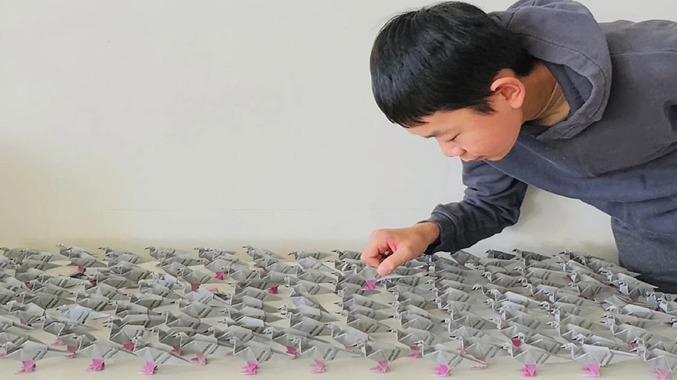 A 14-year-old student demonstrates an origami-inspired engineering structure capable of bearing 10,000 times its own weight, awarded $25,000 in a global STEM competition.
