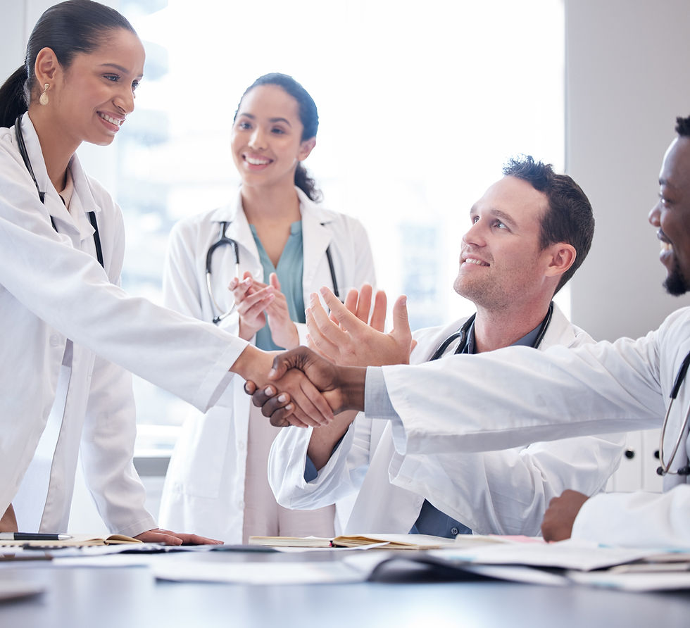 Medical staff shaking hands and high-fiving