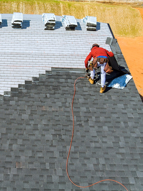 Roofing contractors installing new shingles, Fullerton