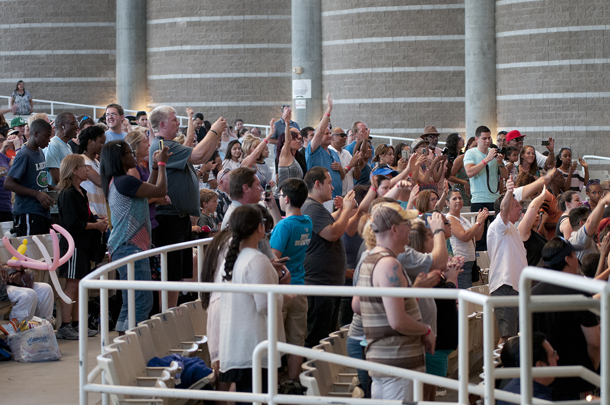 Excited audience applauds enthusiastically at event