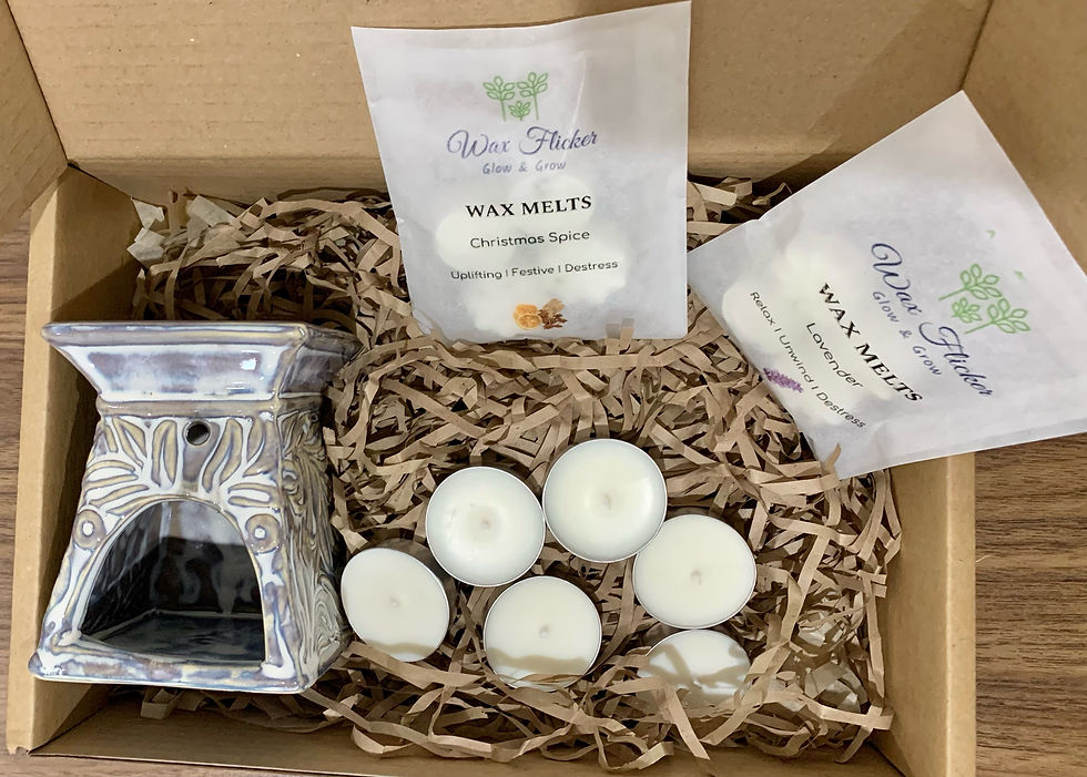  A box with candles and a silver candle holder