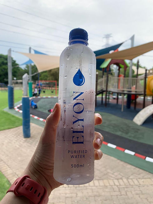 Holding Elyon purified water