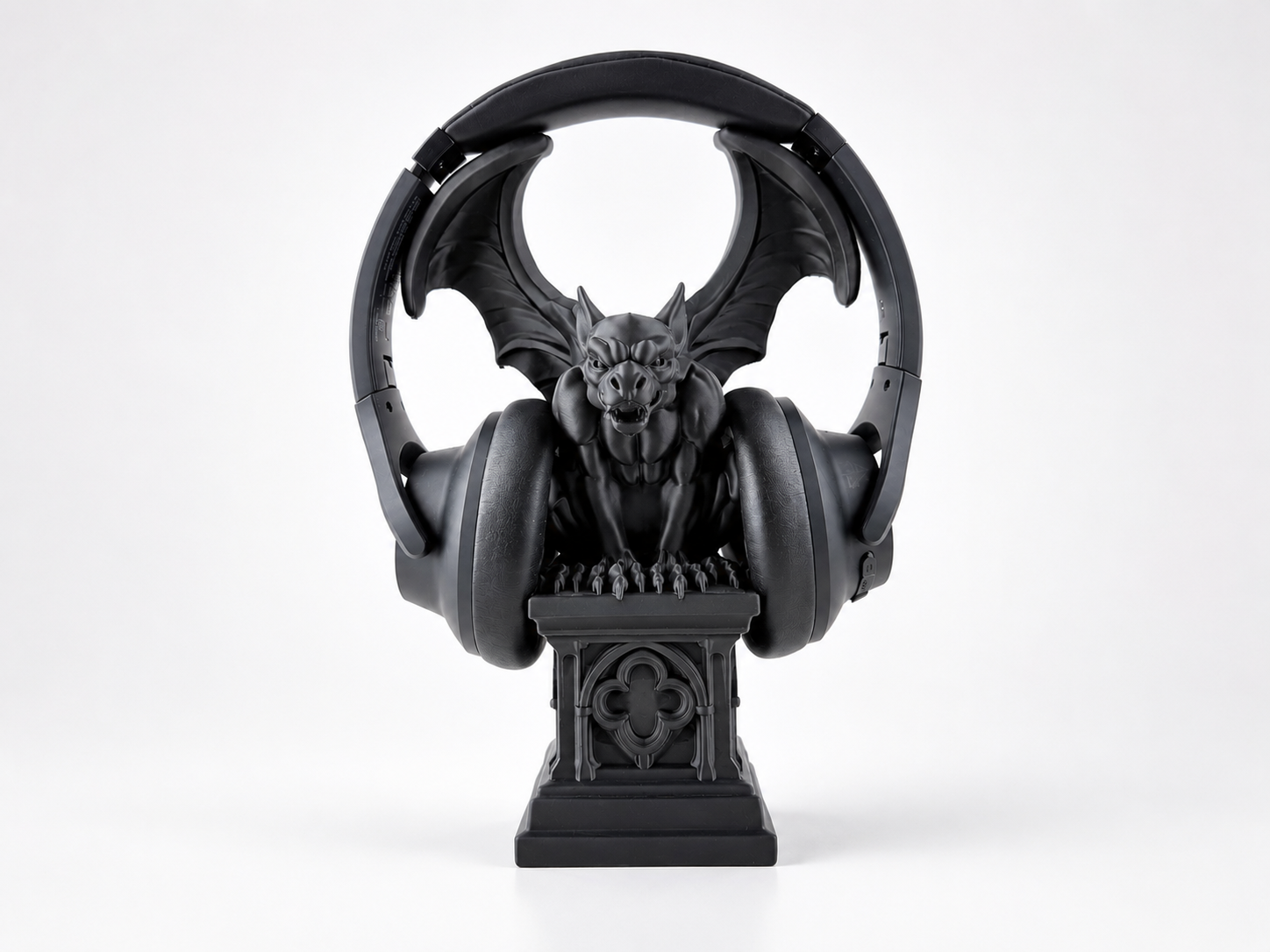 Gargoyle on a pedestal headphone stand that uses wings to support headphones