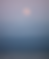 Subtle pink full Moon over clear ocean water in Santa Cruz symbolizing the capacity of somatic therapy to foster healing and vitality along with other modalities offered at Gaia Somasca Psychotherapy via telehealth, or in person in Scotts Valley and Santa Cruz.