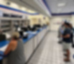 a line at the post office with no employees at the counter