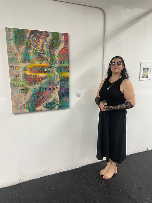 Lova Delis standing next to her painting titled, “Personal Data”