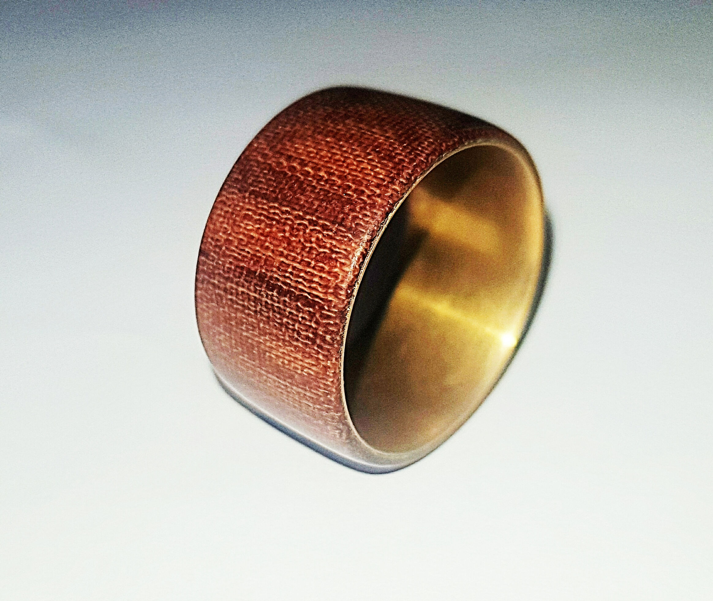 Tuffnol ring with a brass insert, stabilized with Cyanoacrylate adhesive 