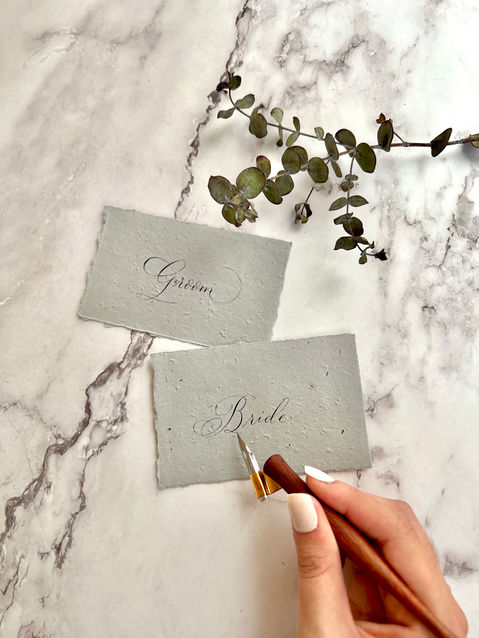 Grey seeded-place cards with Bride and groom calligraphy for wedding, created by Westchester calligrapher