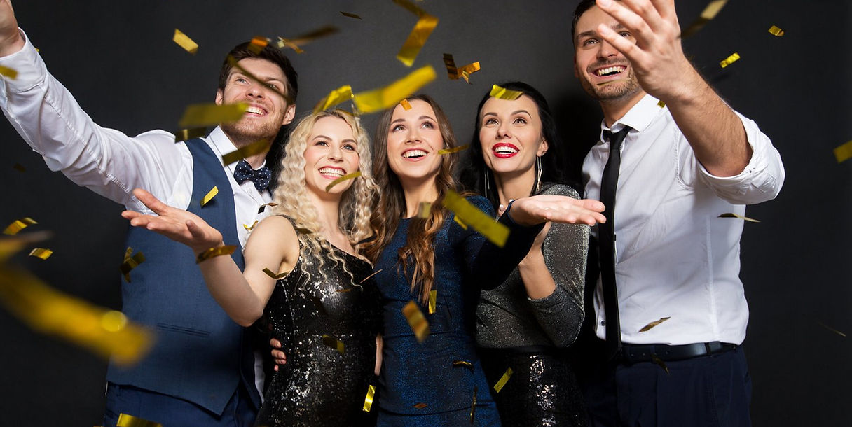 Group of friends celebrating with confetti at a Lets Partys photo booth event