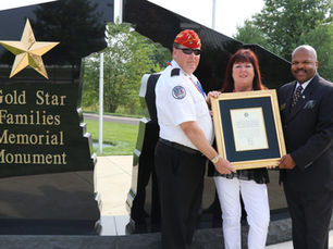 John & Bernadette Heenan presented a proclamation from Senator Pat Toomey (R-PA) to Director Gregory J. Whitney.