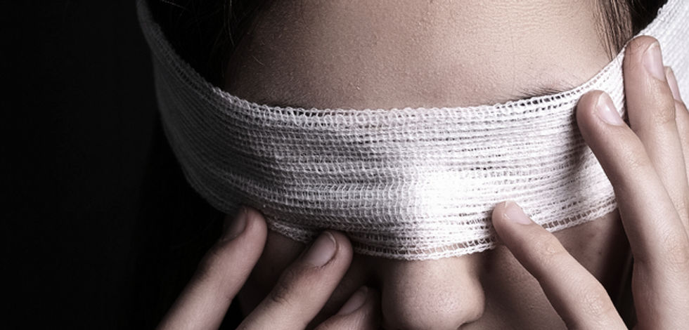 Blindfolded woman closeup. Concept of censorship, human rights, oppression or repression._