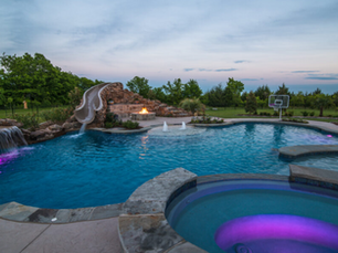 Custom Pool with Adjoining Spa and Water Slide
