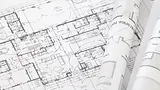 technical-drawings-on-table.webp