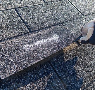 person-inspecting-roof