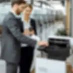 office-employees-using-copier.webp